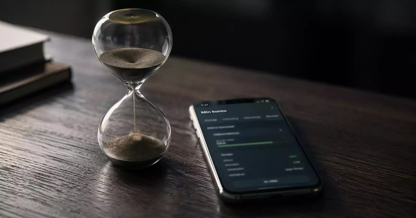 Timeglas ved siden af smartphone med dansk bookmaker-konto og aktiv bonus
